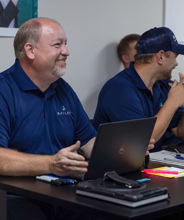 Bailey Equipment and Intralogistics staff in a meeting