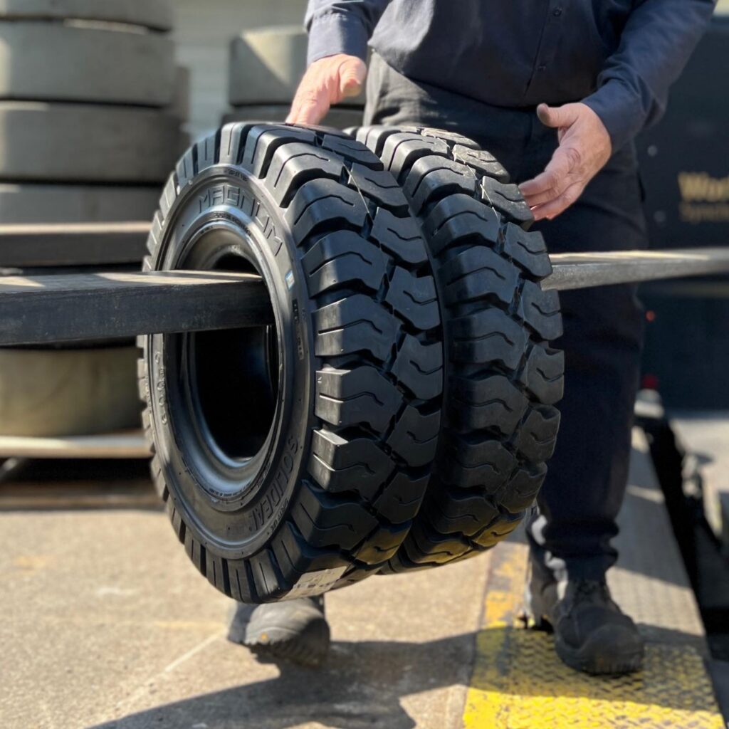 Person holding a tire