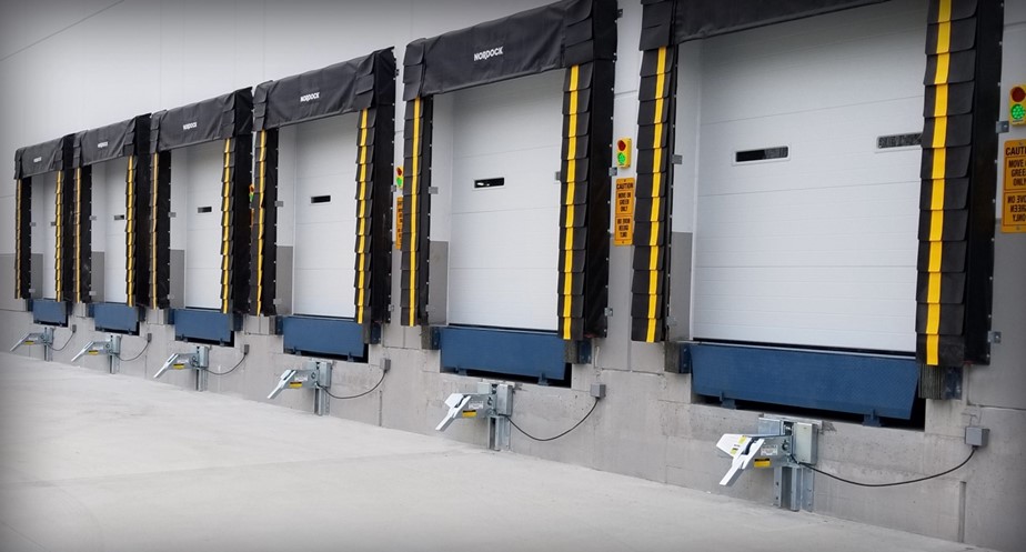 Row of six closed loading dock doors