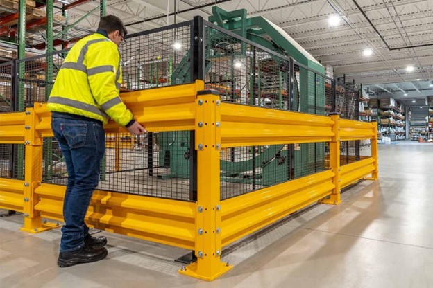 Warehouse worker installing industrial shelving
