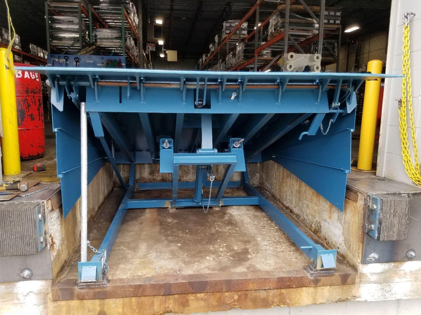 Blue metal structure with forklift highlighting material handling in Tennessee and Kentucky, The Bailey Company Inc.