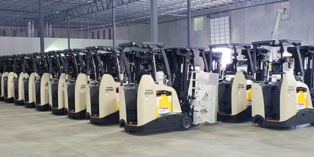 Crown forklifts in warehouse. rental equipment by bailey company